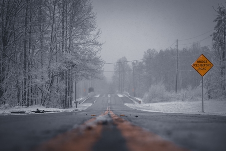 Icy Road with Road Sign
